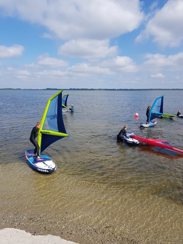 Foto met deelnemers aan clinic Windy Waters